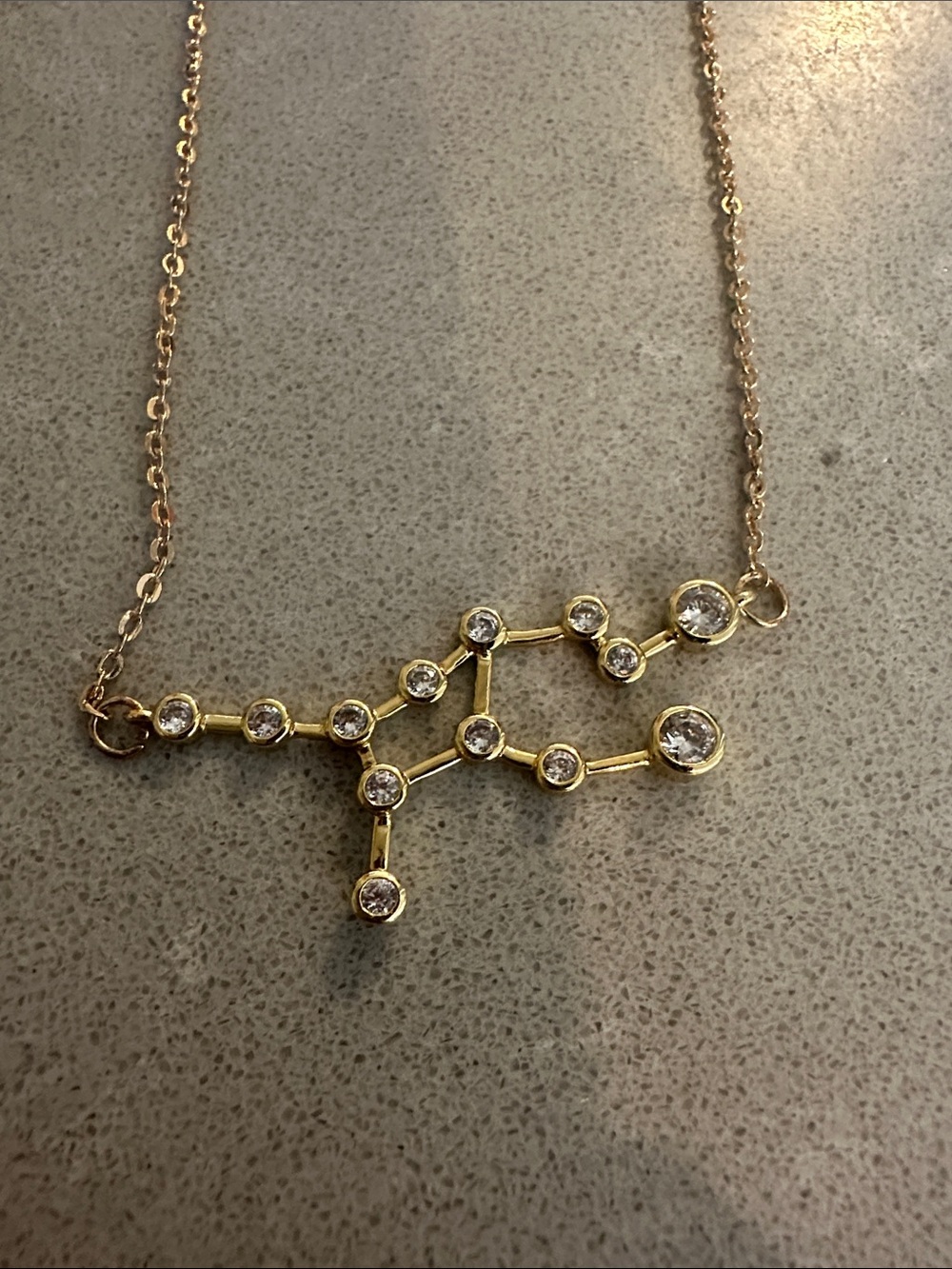 Gold tone Virgo constellation zirconia necklace
